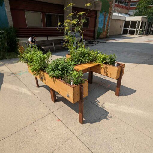 Natural Pod LifeSpace Harmony Garden Box featuring a Coastal Finish, black metal corner accents, and caster wheels for easy mobility.