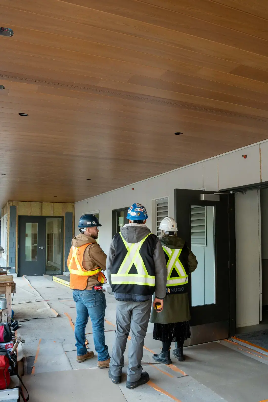 The NUQO construction team inspecting the entrance of the West Vancouver Schools Early Childhood Education Centre.