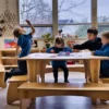 Learners sitting at the Sprig classroom table