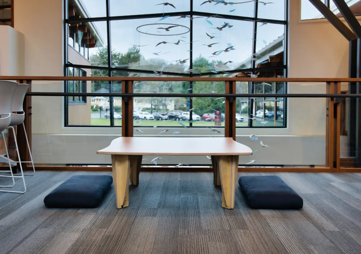 The Sprig classroom table at its lowest height setting with cushions for seating