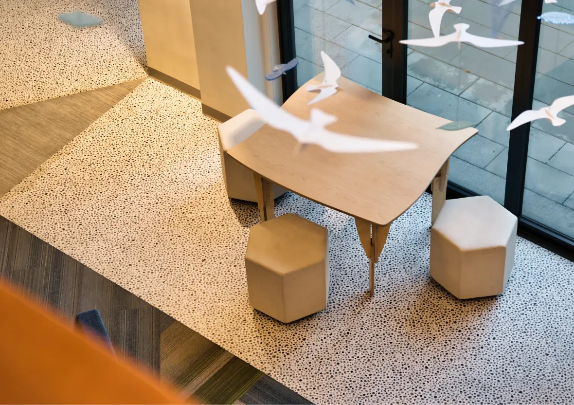 A top-down view of the Sprig Table showing its curved shape